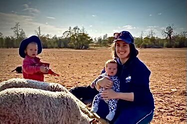 Kate Pianto with her two children on her farm outside Griffith