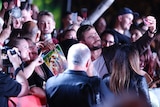 Actor Chris Hemsworth obliges fans for a selfie as he walks the red carpet during the Thor: Ragnarok Australian premiere.