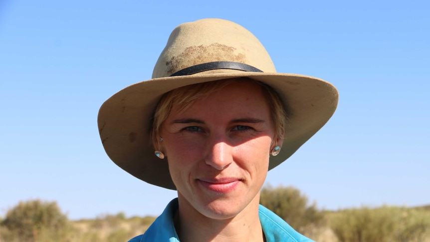 Person smiling in central Australia whilst looking for native mammals