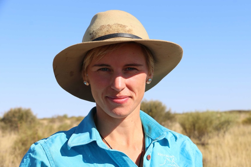 Person smiling in central Australia whilst looking for native mammals