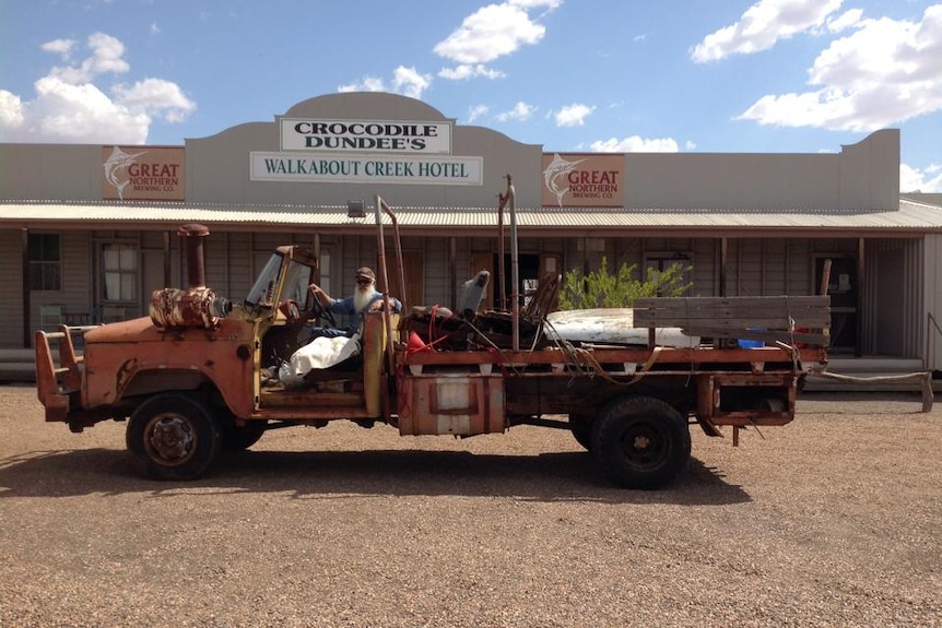 An outback hotel with an old truck out the front.