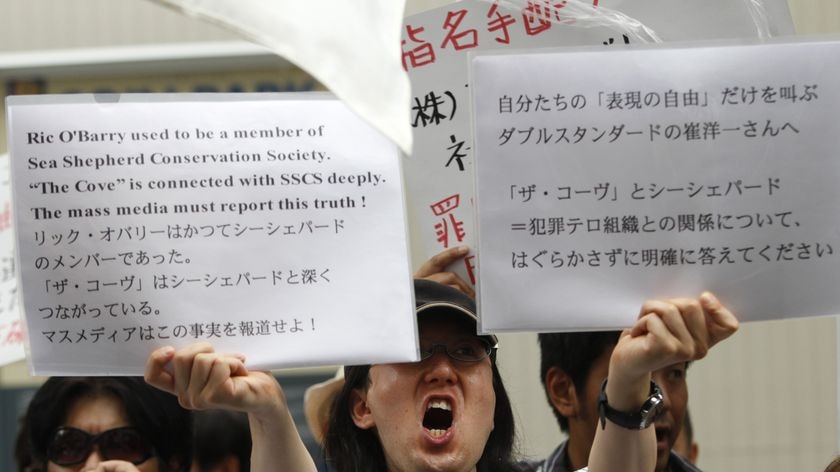 Protesters target The Cove opening