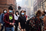 Pedestrians wear masks in Sydney's CBD