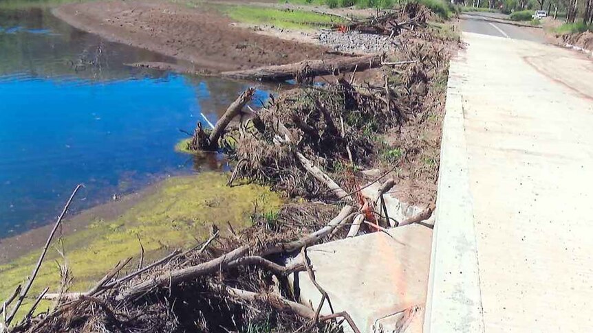 Debris piled against Mt Sylvia Road culvert after the January 2013 flood