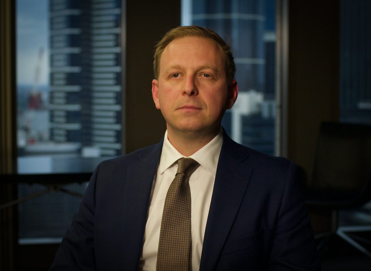 Jeremy Leiber seated in the boardroom of Arnold Bloch Leibler's Melbourne office.