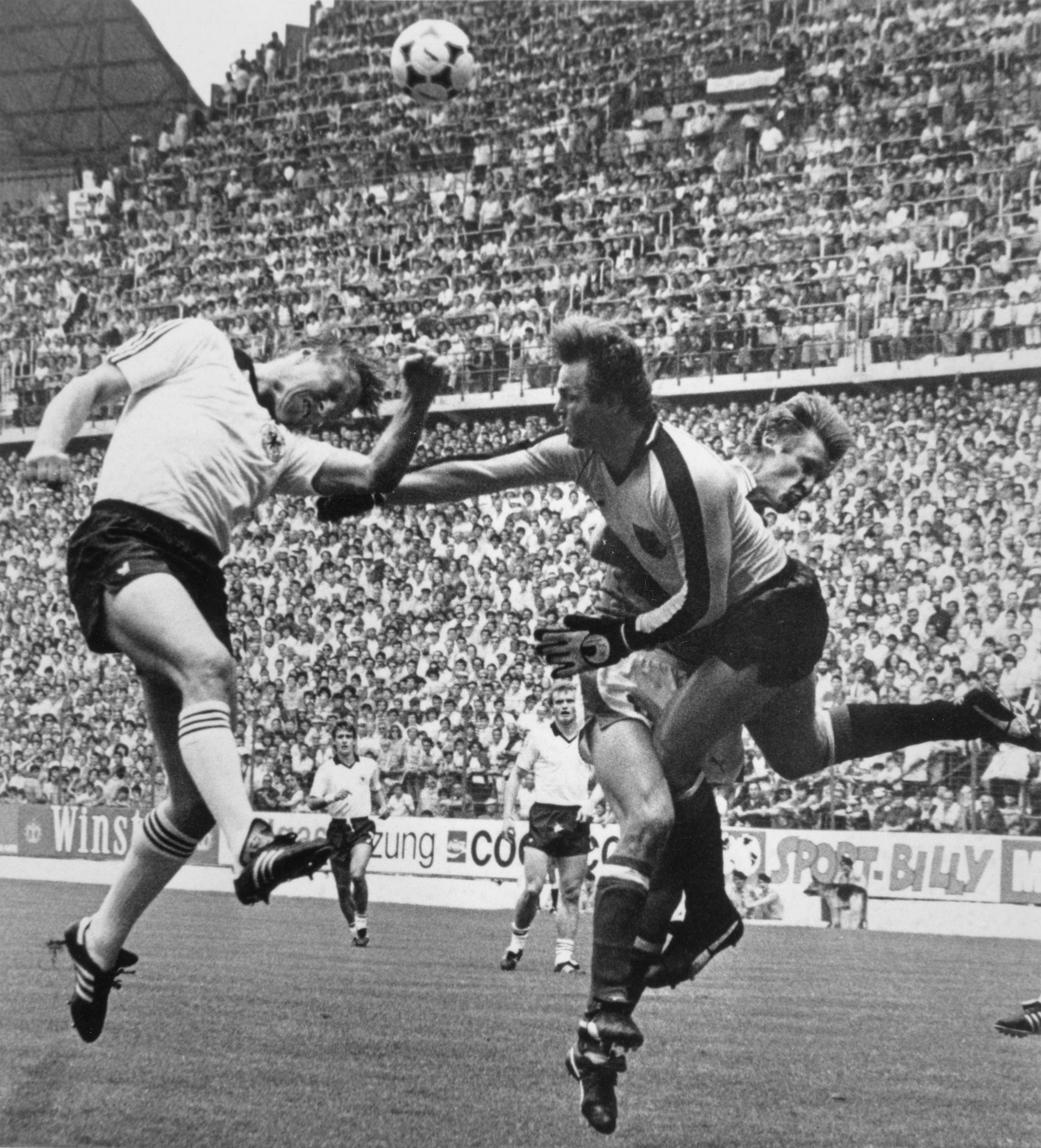 Friedrich Koncilia (right) duels with Horst Hrubesch