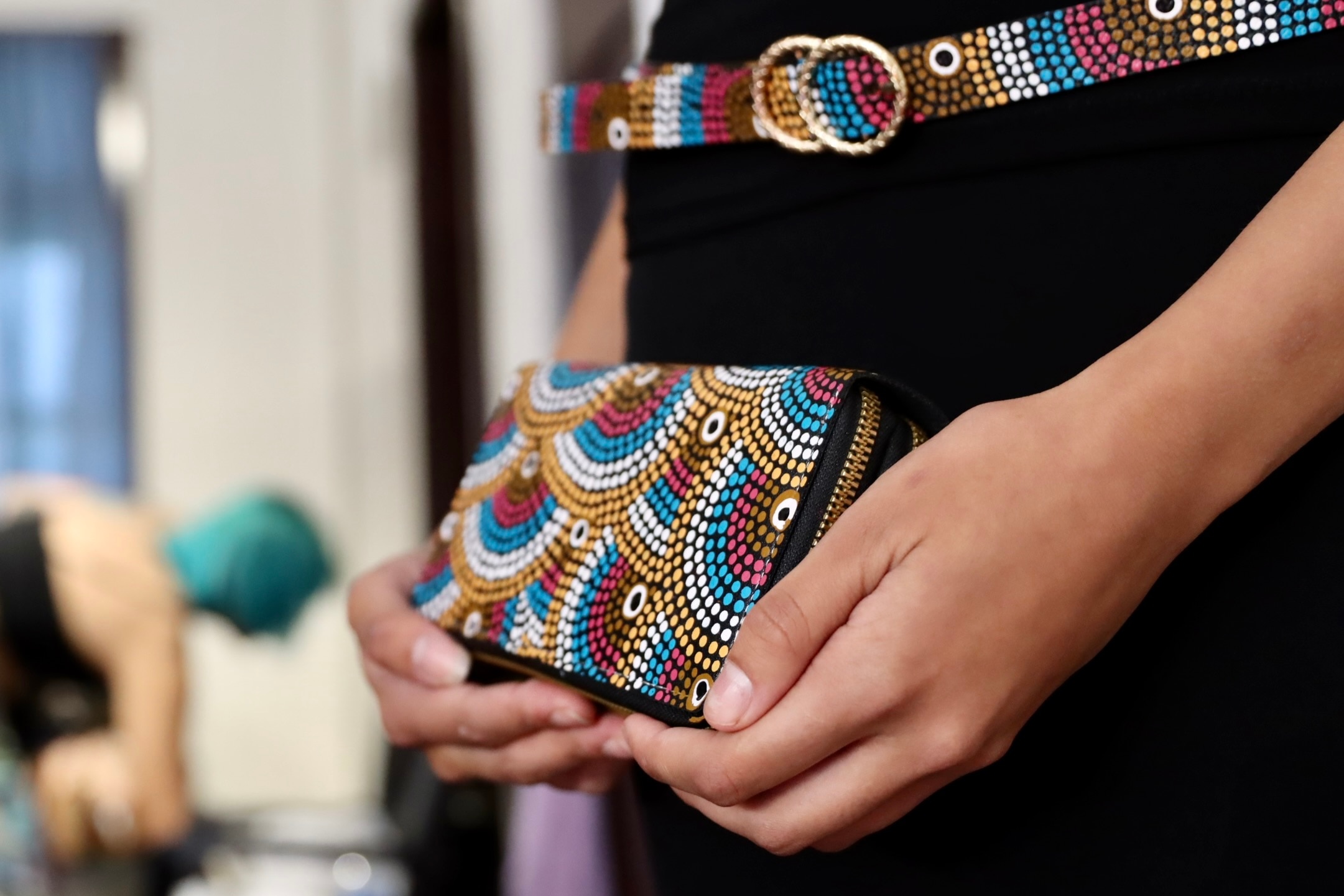 close up of purse and belt with colourful Aboriginal designs
