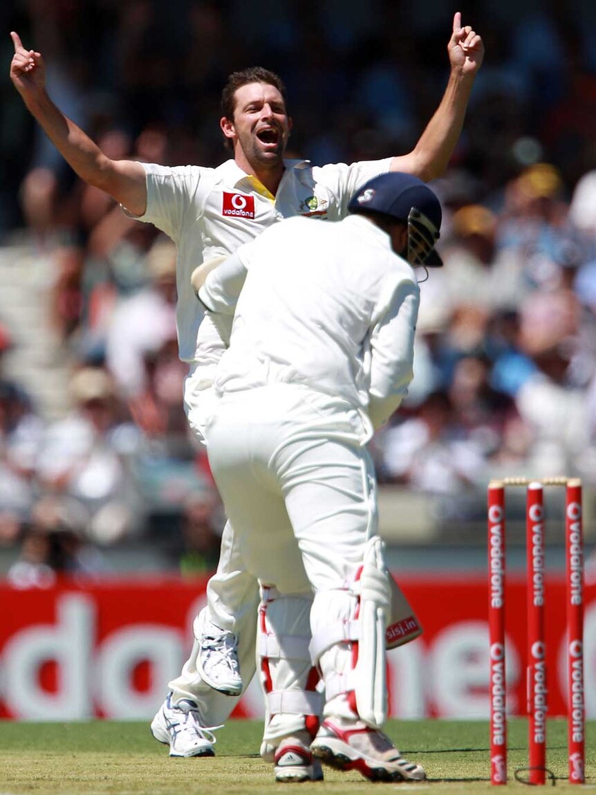 Hilfenhaus celebrates the wicket of Sehwag