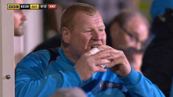 TV still of Wayne Shaw eating a pie