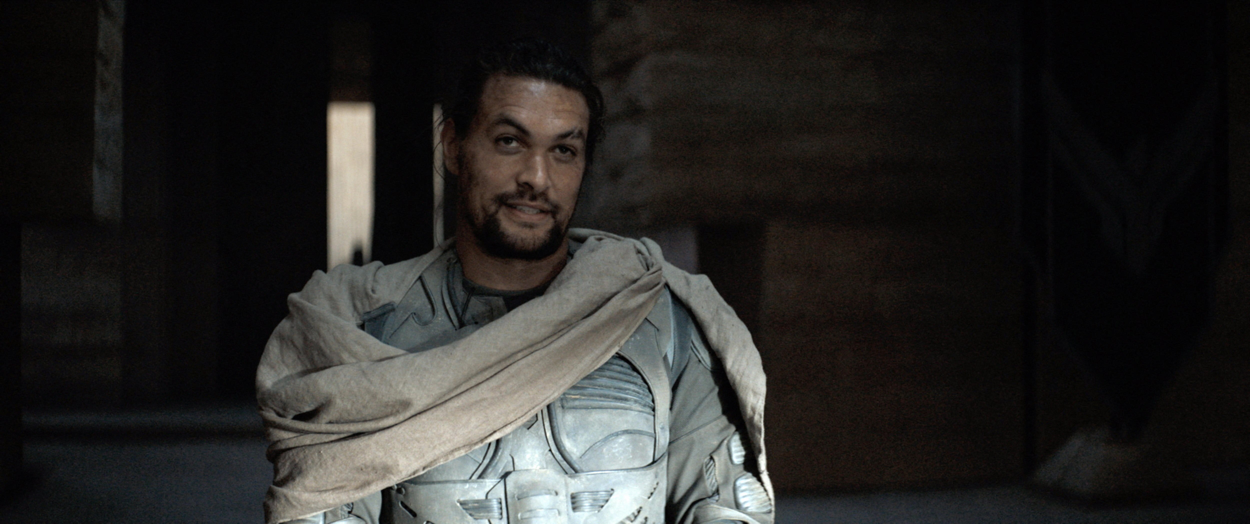 Jason Momoa dressed in a white futuristic suit of armour.