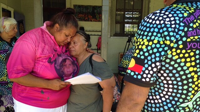Michelle Jarrett is comforted by a relative, looking forlorn and disappointed.