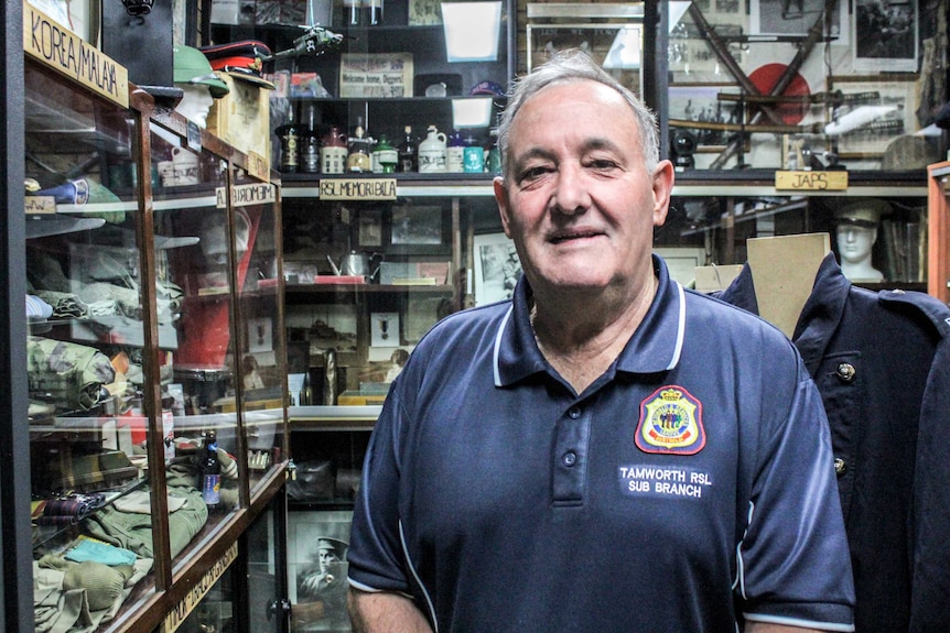 Tamworth RSL President Bob Chapman inside the local RSL museum, surrounded by uniforms and military memorabilia