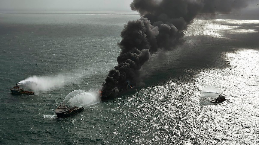 Smoke rises from the vessel in flames off Colombo port.