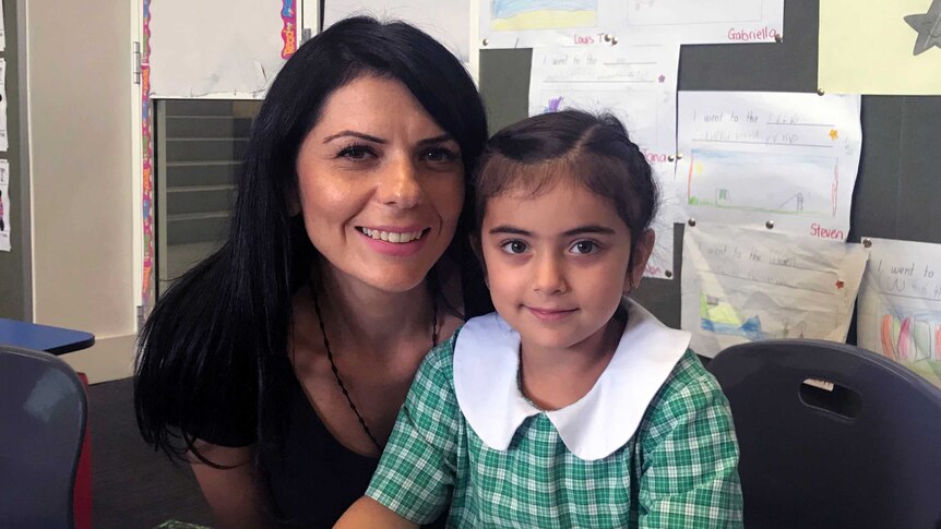 Mary Moussa with her daughter, who attends St Felix's Catholic Primary School