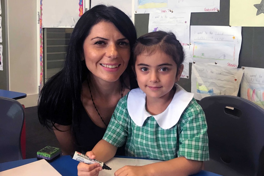 Mary Moussa with her daughter, who attends St Felix's Catholic Primary School