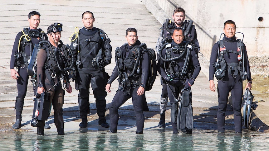 Clearance divers converge on slipway