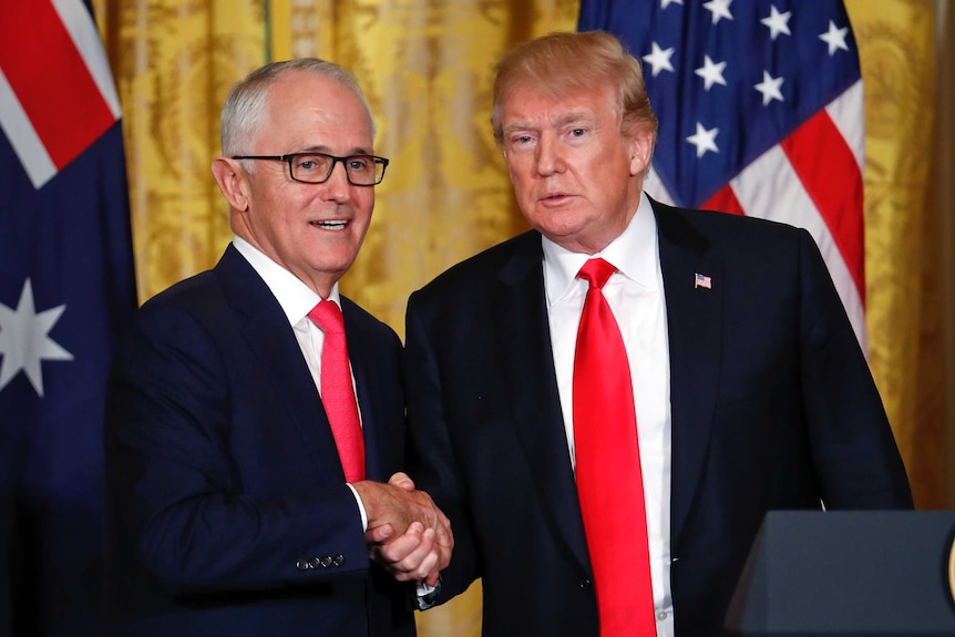 Donald Trump and Malcolm Turnbull shake hands at the White House.