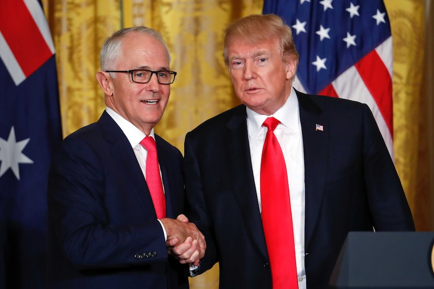 Donald Trump and Malcolm Turnbull shake hands.