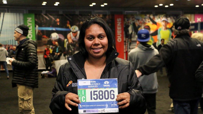 Eileen Byers holds her number for the New York Marathon