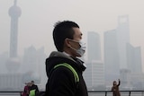 Man wears mask on polluted day in Shanghai