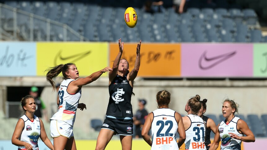 Rhiannon Watt of the Blues takes the ball out of the ruck against the Crows.