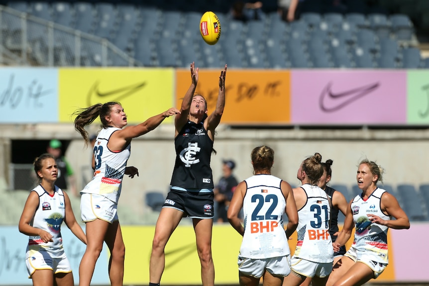 Rhiannon Watt of the Blues takes the ball out of the ruck against the Crows.