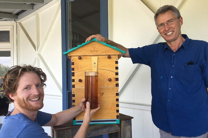(LtoR) Hive inventors Cedar Anderson and his father Stuart Anderson with one of their hives.