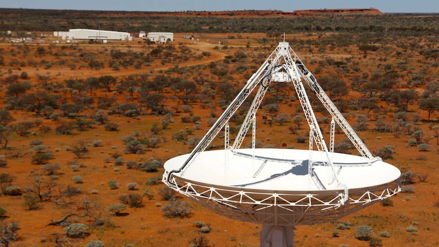 A drone image shows large white antennas built on the red earth of the Murchison.