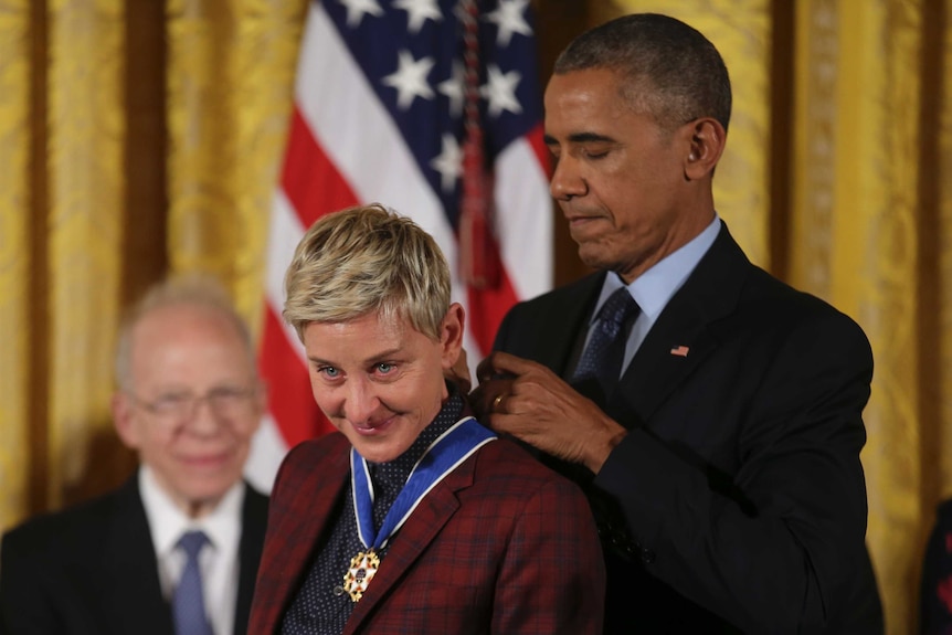 US President Barack Obama presents the Presidential Medal of Freedom to comedian and talk show host Ellen DeGeneres