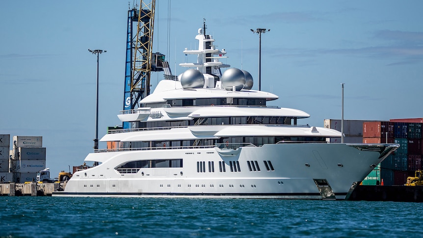 A large white superyacht berthed at Queens Wharf in Lautoka, Fiji.