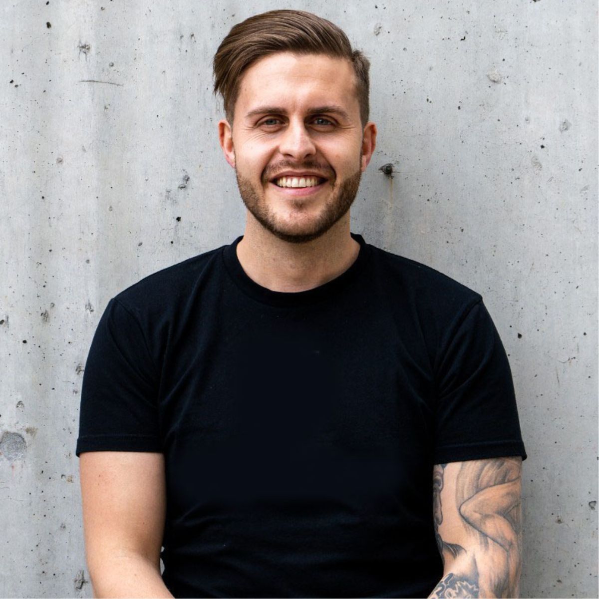 Basic portrait of a young man wearing a plain black tshirt