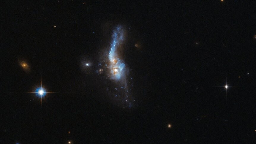 NASA's Hubble space telescope captures an image of two galaxies colliding, known as IRAS 14348-1447.