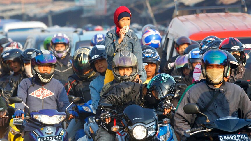 Motorcyclists on the road in Indonesia