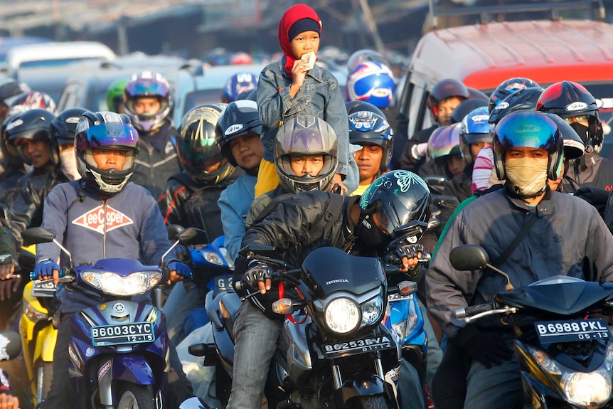 Motorcyclists on the road in Indonesia