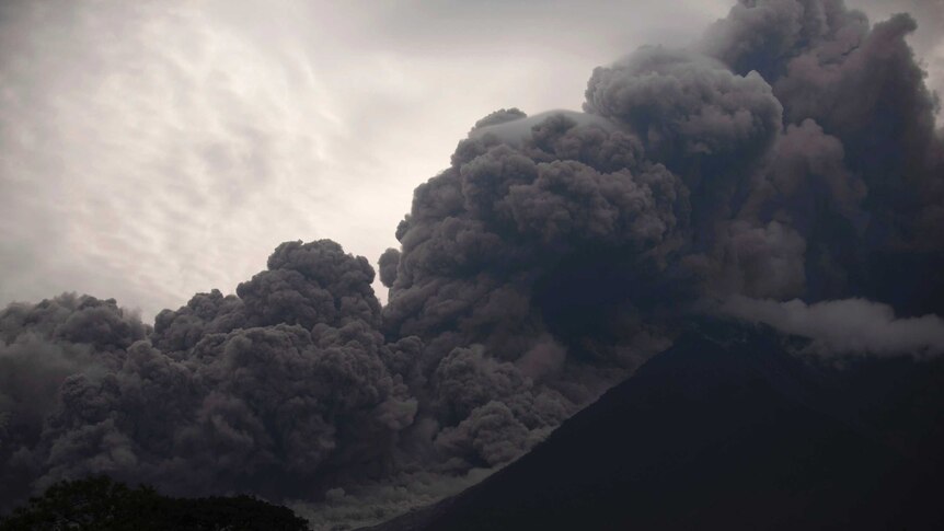 Volcan de Fuego in Guatemala. It is blowing out a thick cloud of ash.