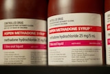 A close-up of brown Aspen Methadone Syrup bottles