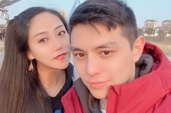 Chelsea Yang and Anthony Ange pose for a selfie.