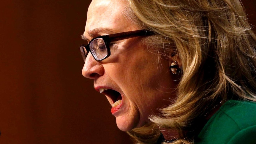 Hillary Clinton pounds her fists during hearing.