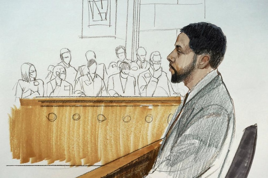A sketch of a man with short dark hair and a closely shaven beard sits in a dock with jurors impaneled in the background 