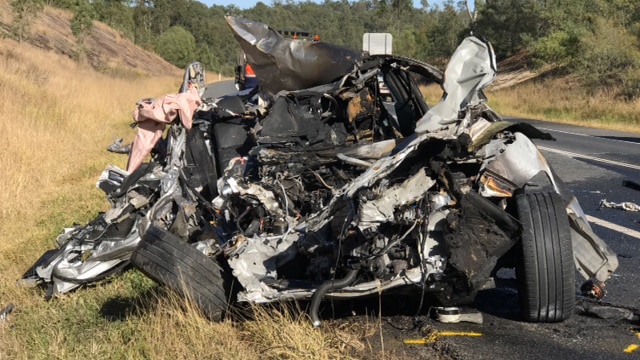 The wreck of a car where a 19-year-old teenager was killed in a fiery crash on the Centenary Highway at Ripley