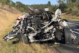 The wreck of a car where a 19-year-old teenager was killed in a fiery crash on the Centenary Highway at Ripley
