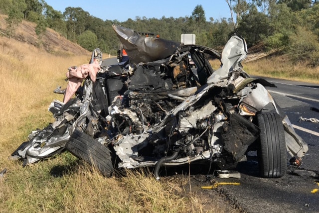 The wreck of a car where a 19-year-old teenager was killed in a fiery crash on the Centenary Highway at Ripley