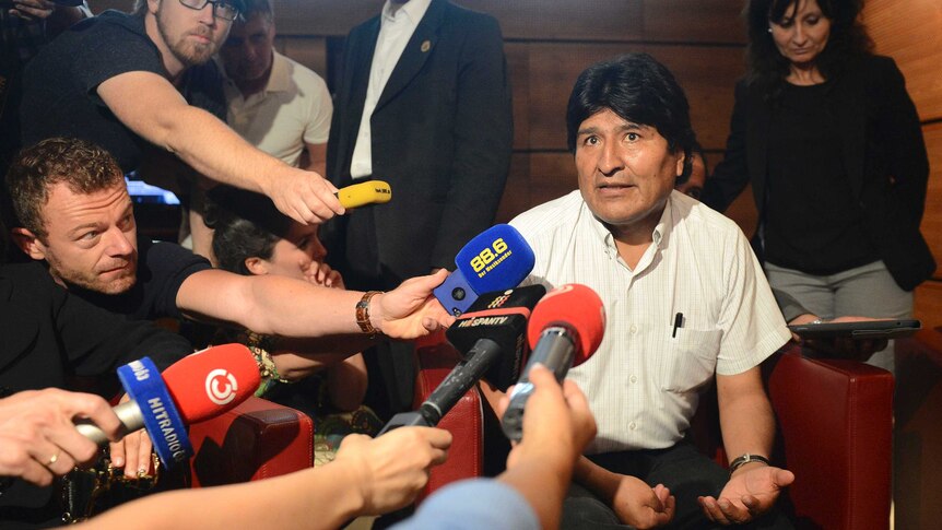 Evo Morales talks to journalists after plane diverted