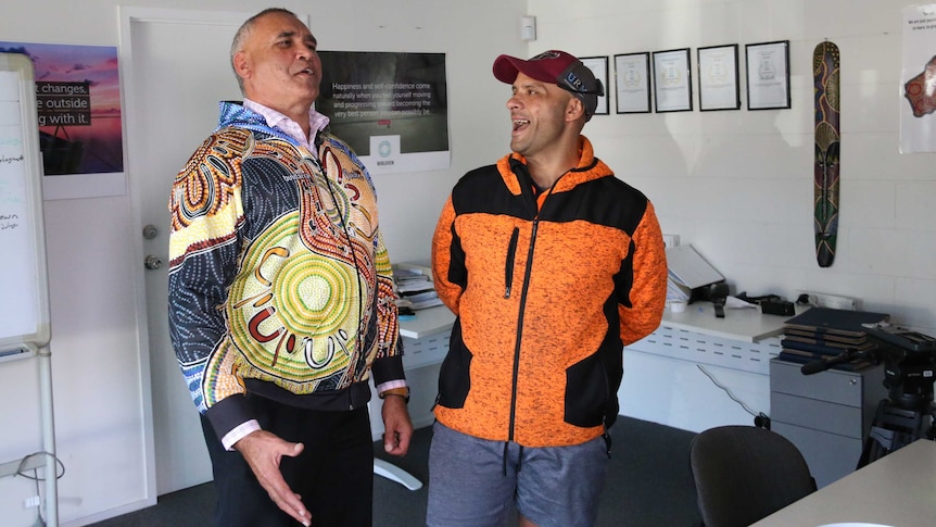 Anthony Longbottom with Albert Barker joke and laugh together at the Worldview office.