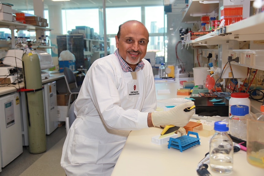 Professor Rajiv Khanna sitting in his lab.