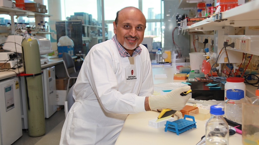 Professor Rajiv Khanna sitting in his lab.