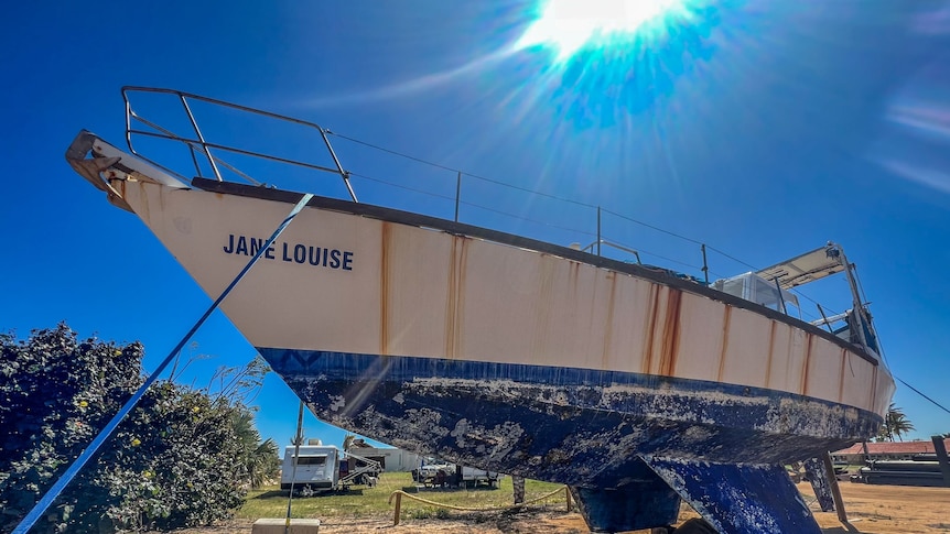 A boat sits in disrepair in the yard at Carnarvon's yacht club