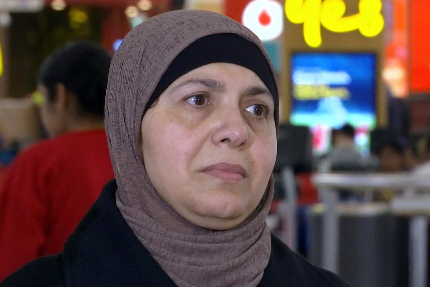 newly arrived Tahani Dawwas at sydney airport after escaping gaza for australia