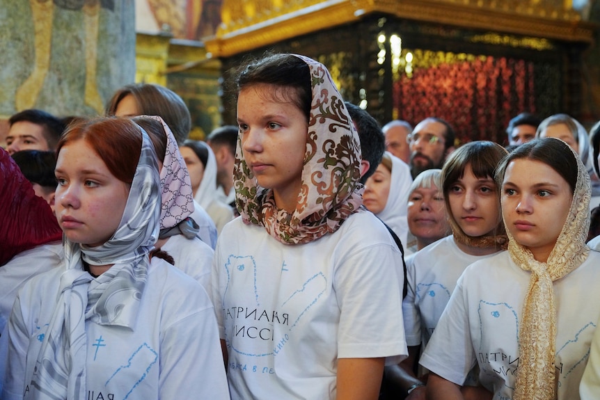  Children from the affected families of Donbas attend a religion service.