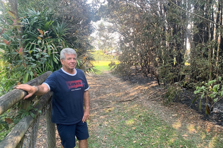 Blackened soil shows just how close the fire came to Mr Orkibi's own home.